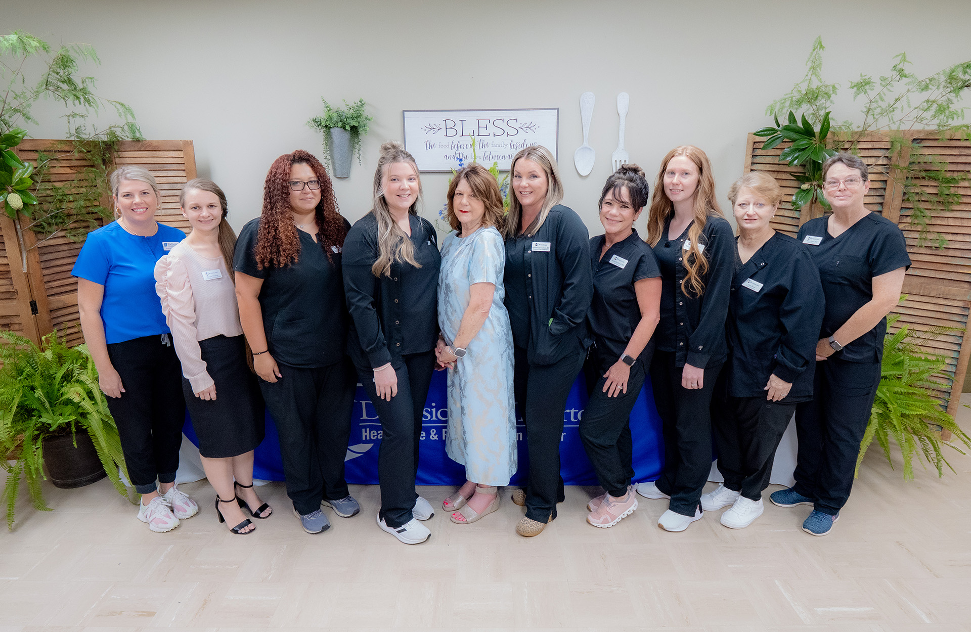 Diversicare of Tylertown staff team smiling together for a group photo.