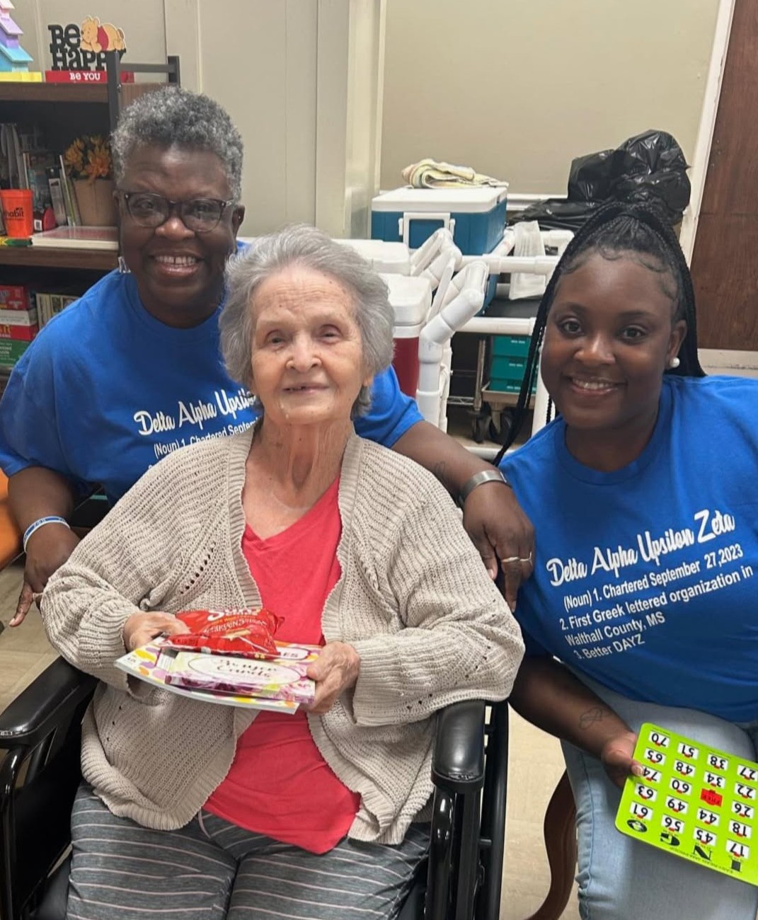 Diversicare of Tylertown two female team members sitting and posing with a female resident. 