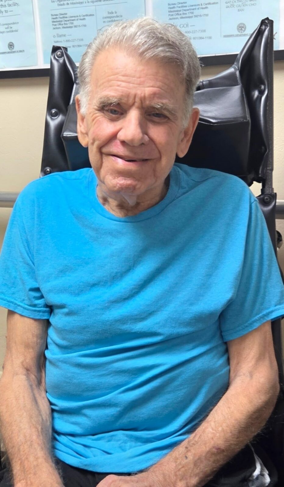 Diversicare of Tylertown resident man in a aqua blue shirt smiling.  